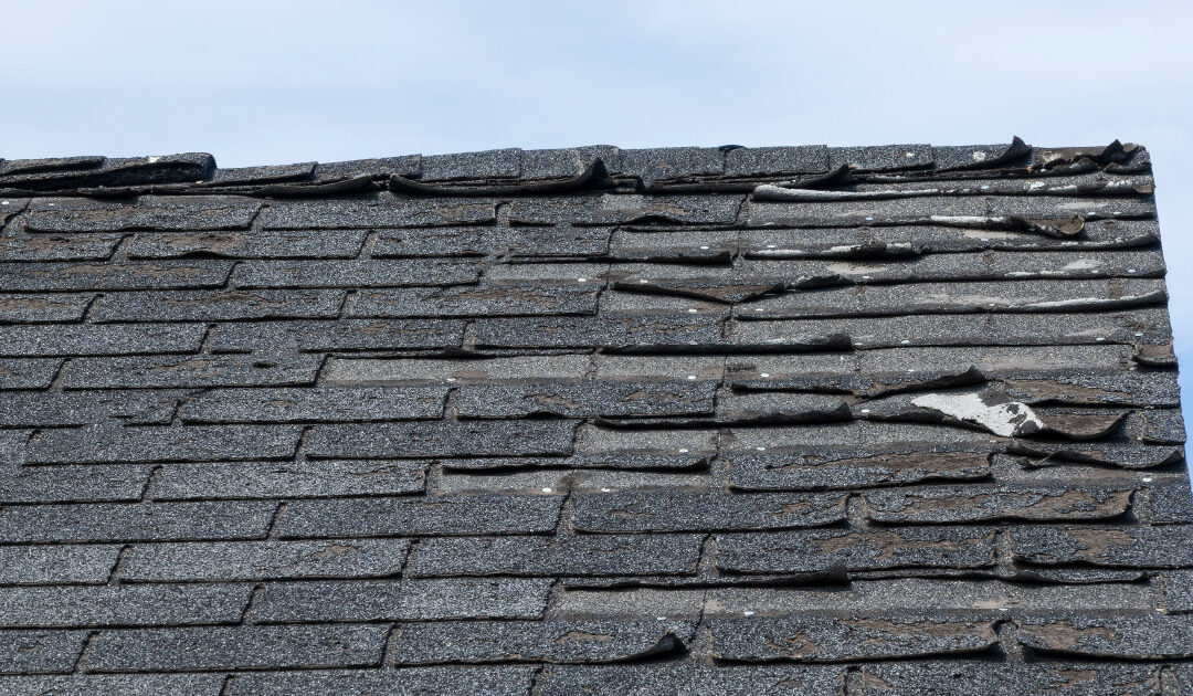 An old, damaged roof in need of replacement