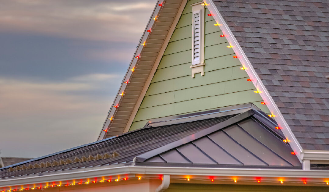 A residential roof with holiday lights